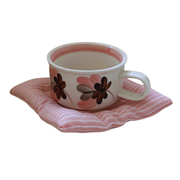 Coquette Cushion Coaster with a cup of coffee